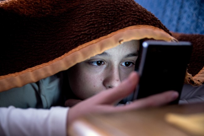 Child looking at a mobile screen