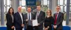 A photograph showing representatives of the University of Glasgow and Glasgow Clyde College at the signing ceremony for a new memorandum of understanding between the two institutions