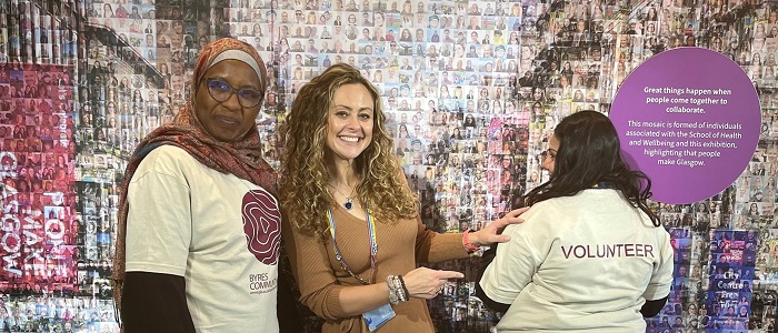 An image of two Byres Hub Volunteers with Susan Grant showing off the new Byres Hub Volunteer shirts