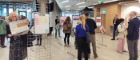 People looking at exhibition boards in the Advanced Research Centre