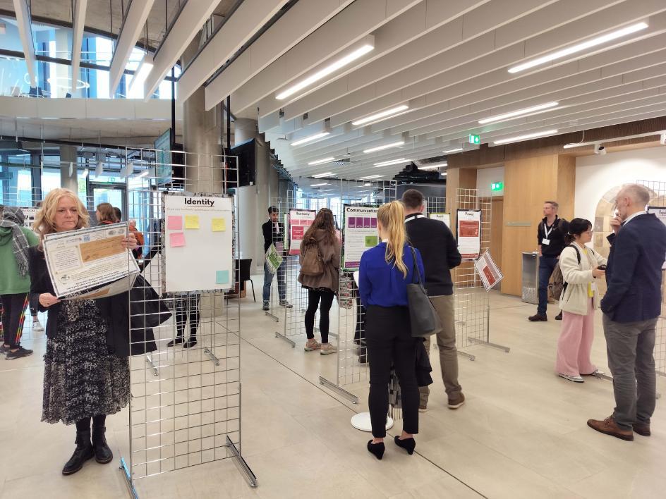 People looking at exhibition boards in the Advanced Research Centre