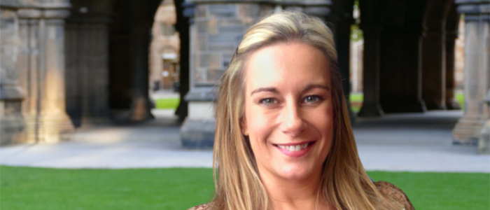 Louise Walker standing in the West Quadrangle, University of Glasgow