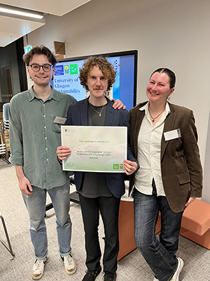 Group photo of three students receiving their certificate