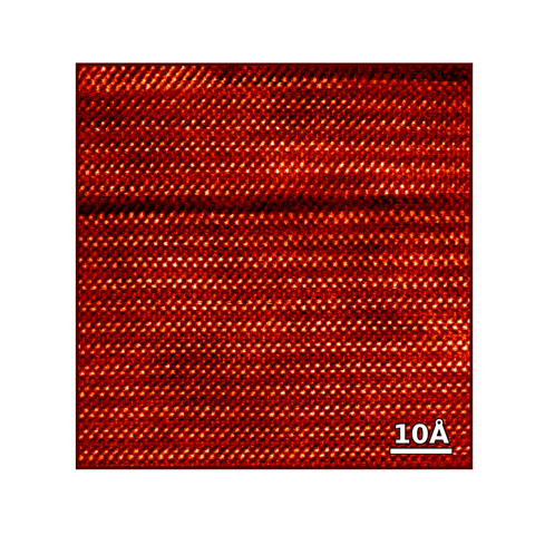 A high resolution of a crystalline material, showing a regular lattice of atoms. Deviations from the regular pattern are defects that often produce unusual material properties.