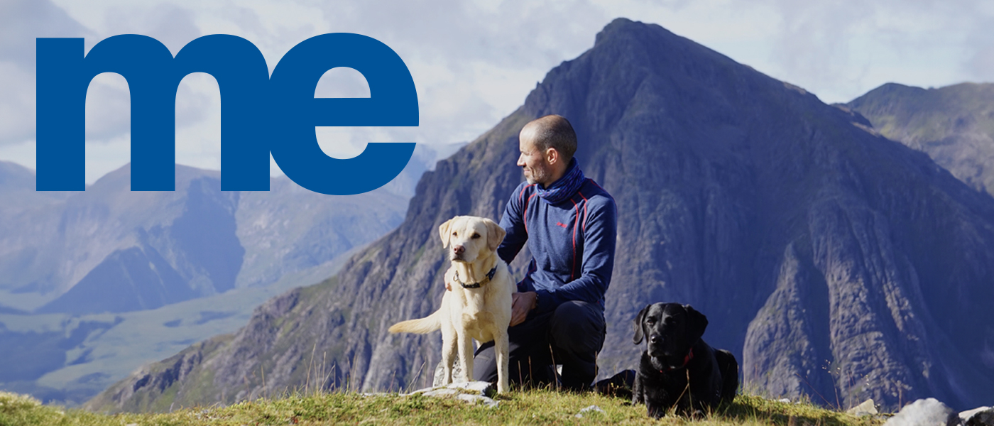 Andre Cotter with his dogs in the mountains