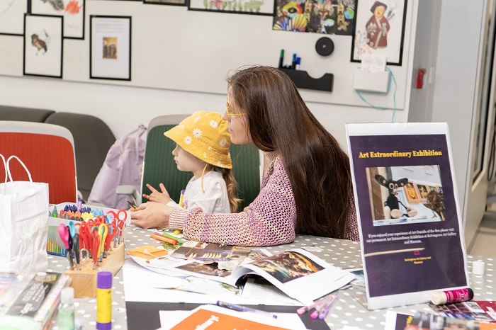 Mother and daughter sit making art at Byres Community Hub Day 2024