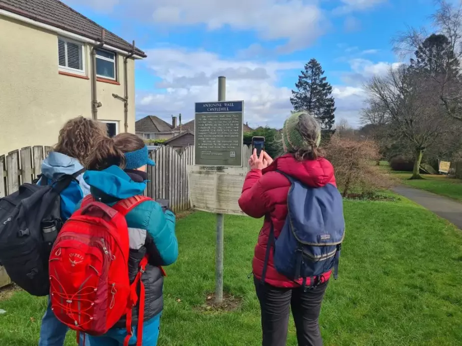 Jennifer McArthur, Bella Hoogeveen and Alison Phipps in front of Antonine Wall Castlehill sign