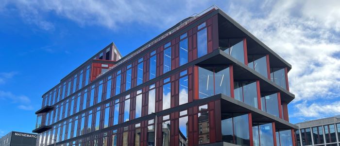 picture of the exterior of the Clarice Pears Building at University of Glasgow with blue sky above