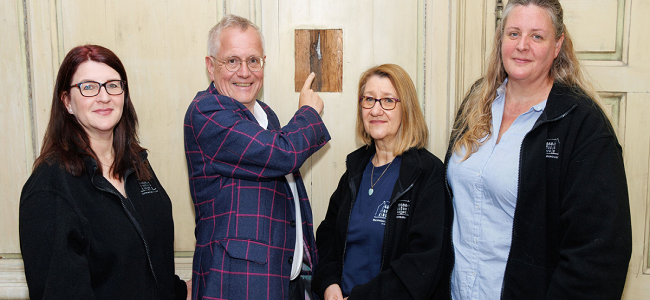 The Bannockburn House team discovering the bullet hole that is evidence of an attempt to assassinate Bonnie Prince Charlie.