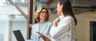 Two business women smiling