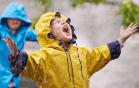 Child having fun in the rain