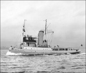 A photograph of the tugboat Hashim, built for the Iraqi Government by Scotts & Sons of Bowling, on trials in the Firth of Clyde, 1950s.  (GUAS Ref: GD 322/13/14.  Copyright reserved.)