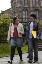 Two students walking through campus