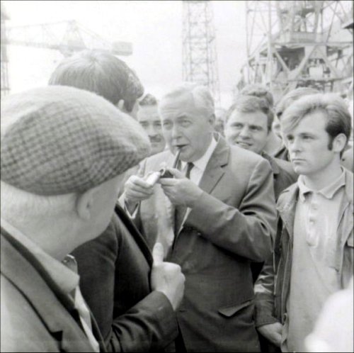 The Prime Minister, Harold Wilson, talks to some of the workers.