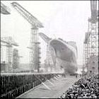 The QE2 slides down the slip way.