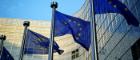 Image of European Union flags flying outside the EU headquarters in Brussels