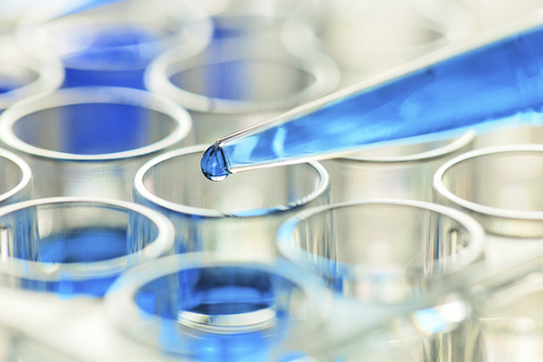 Close-up shot of a pipette and test tubes 