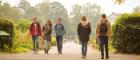 Students walking in park 