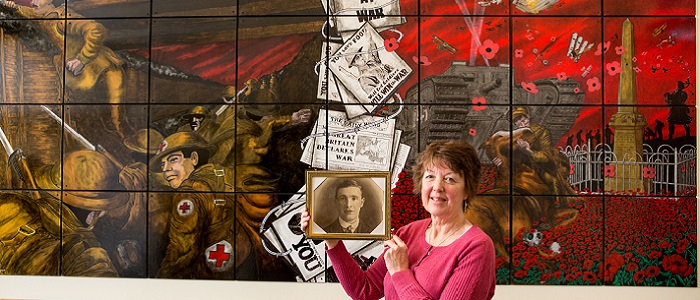 Moira Gallie holding a photo of her grandfather who was treated at the Erskine Hospital after losing a limb in WW1 at launch of Erskine Hospital archives going online