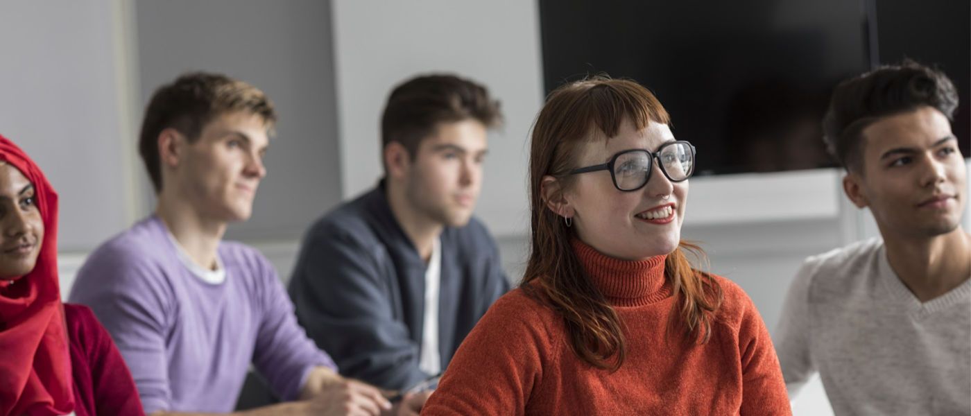 Smiling students in a classroom