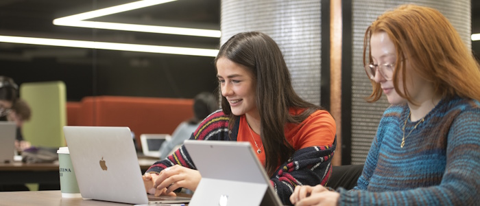 2 students studying in the James McCune Smith building