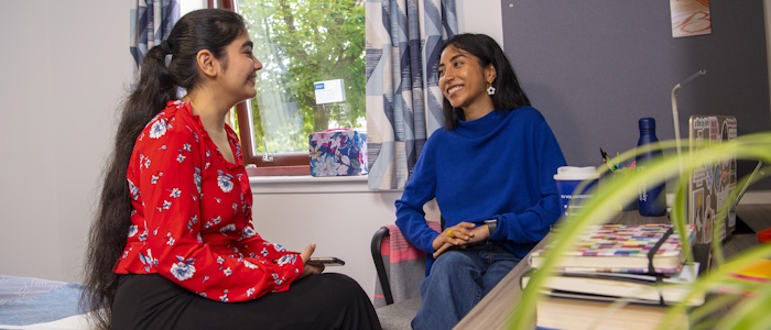 students chatting in a room