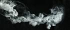 Image of smoke drifting across a black background