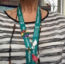 Photo of LGBT+ badge on IHW lanyard