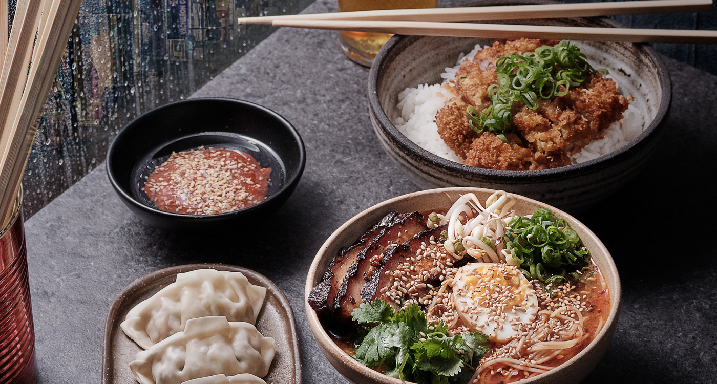 Popular dishes of Katsudon (a bowl of rice topped with deep-fried pork), ramen and dumplings.