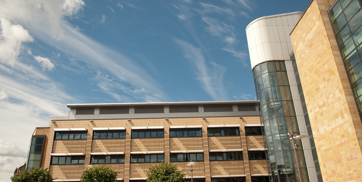 The Sir Graeme Davies Building beneath blue skies on a summer's day