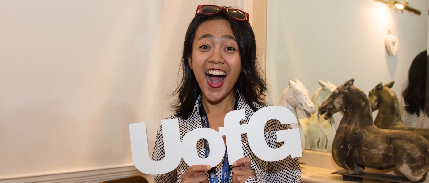 Girl with UofG Letters smiling