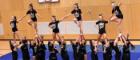 Members of Glasgow University Cheer doing a pyramid stunt