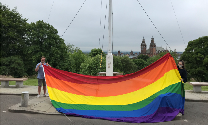 Two SRC members with the Pride flag