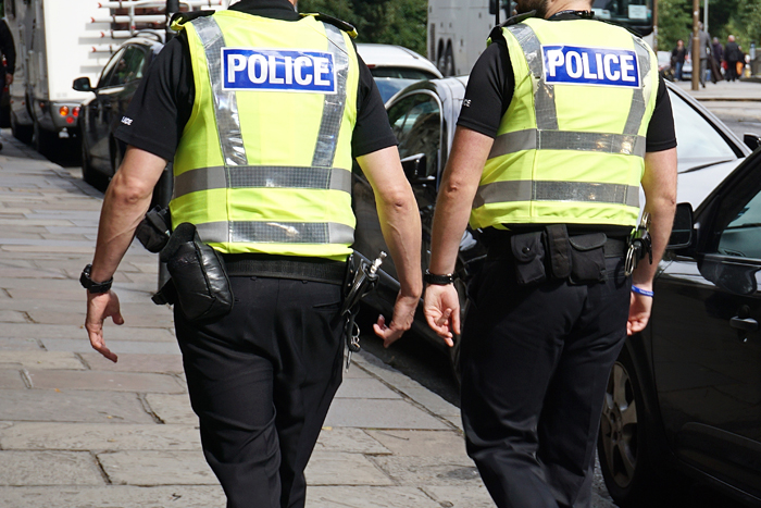 Photo of back view of police officers