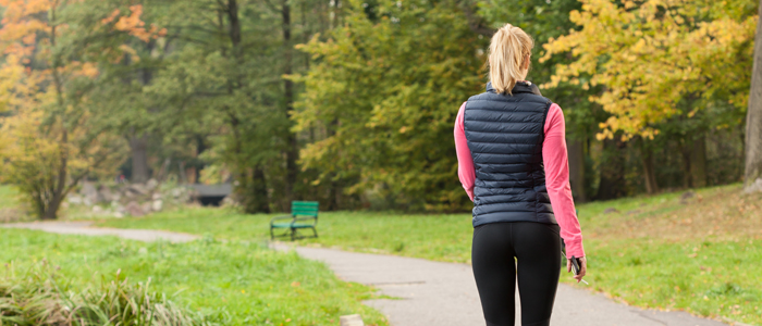 Photo of person walking through park