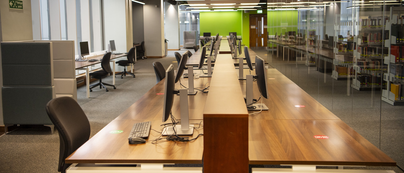 Desks and computers in the Main Library.