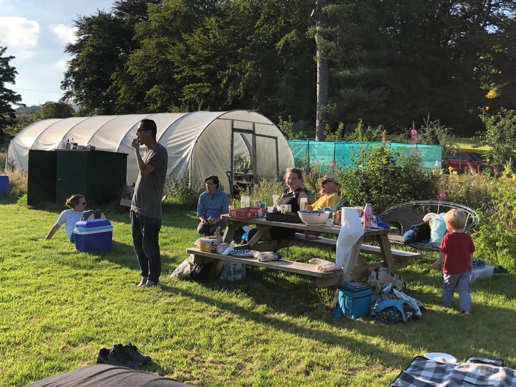 Folk relaxing at Cochno Farm