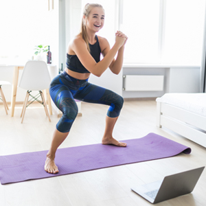 A student in an online yoga class [Photo: Shutterstock]