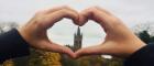 Heart hand in front of UofG tower