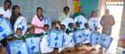 Children at the BION clinic in Kenya receiving their insecticide-impregnated bed nets as part of the malaria prevention programme.