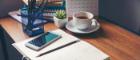 Photo of desk with diary, pens and calendar