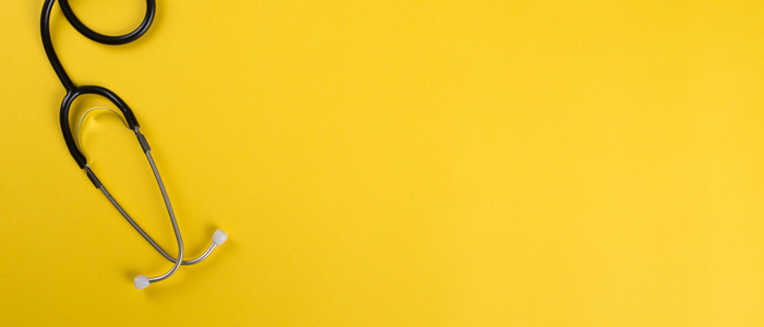 Photo of stethoscope with yellow background