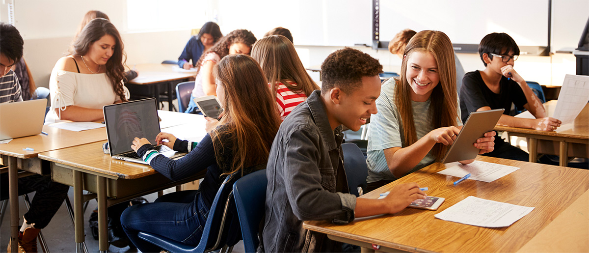 Students chat at their desks