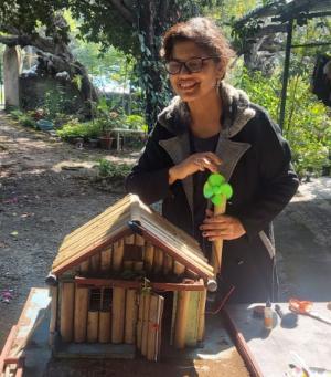 Participant in the STEM challenge presenting her model house