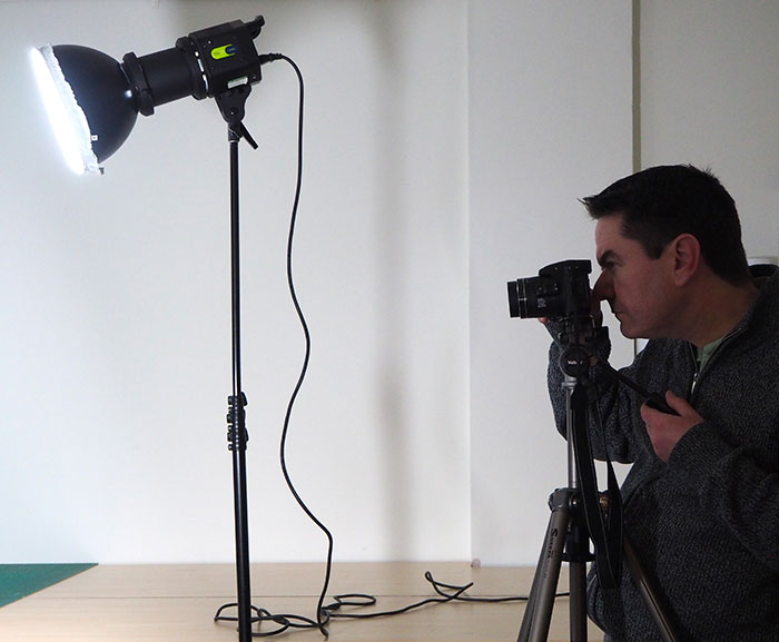 Image of Peter McKenna in the process of taking a photograph.