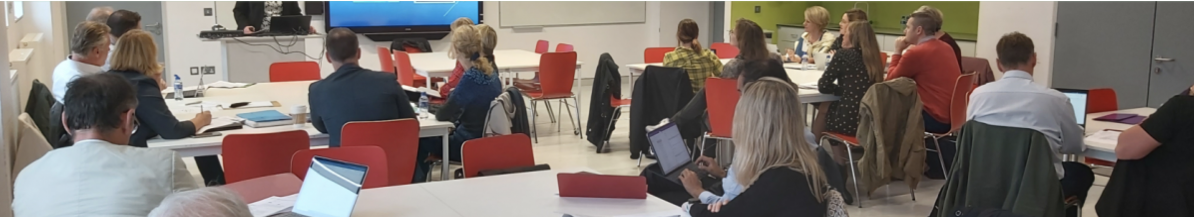 delegates attending a seminar in a large lecture theatre