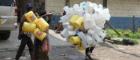 People carrying plastic bottles for reuse