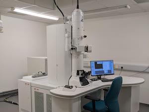 White electron microscope in a white laboratory with grey floor