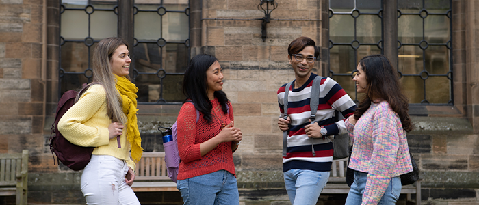 students chatting on campus