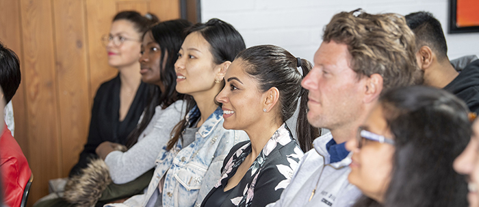 Students sitting in a class looking forward